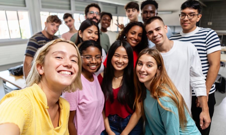 diverse-group-of-young-student-people-taking-selfi