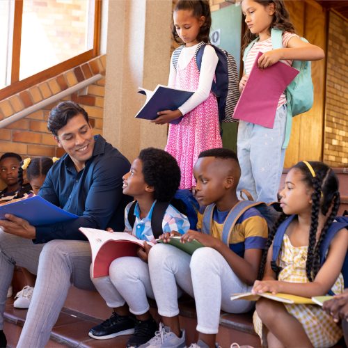 kindergarten-students-sitting-on-stairs
